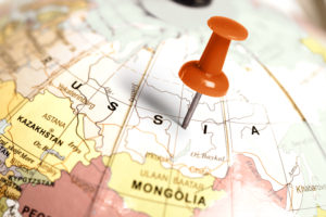 Globus mit Pin auf Russland